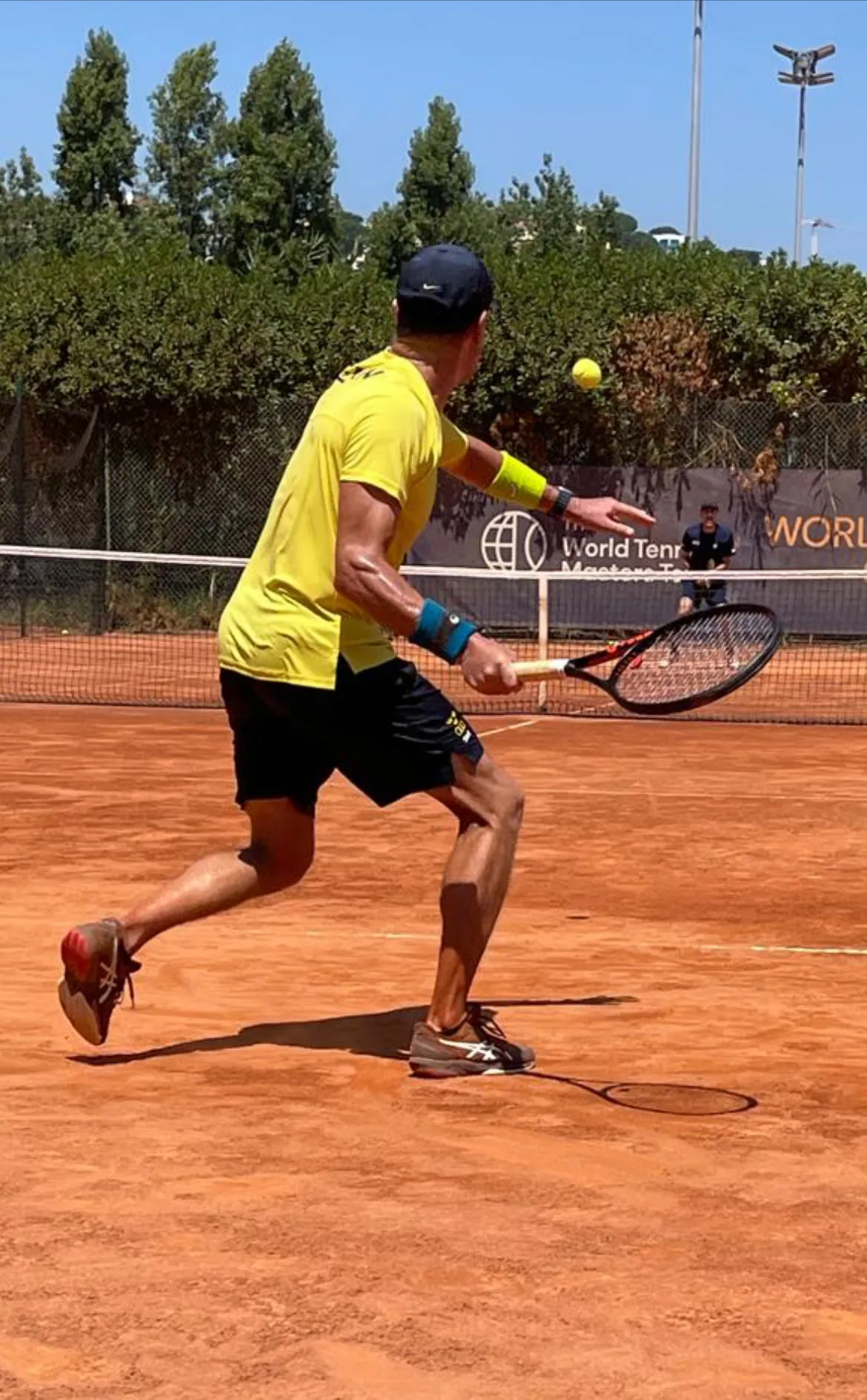 Pontus chasing down a forehand on a clay court at the World Championships in Lisbon, Portugal