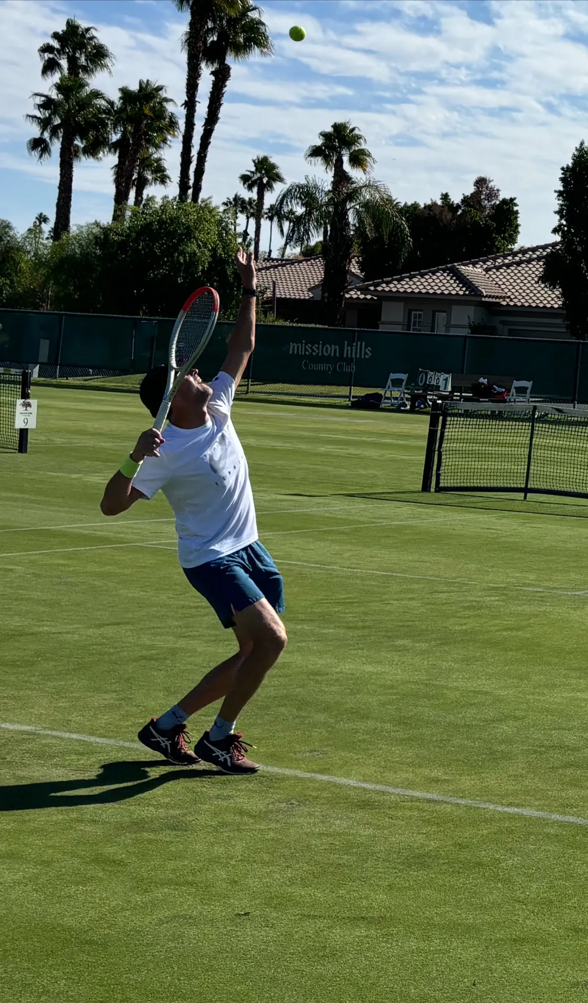Pontus leaping into a serve on a grass court at the National Championship, Mission Hills Country Club, Rancho Mirage